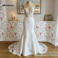 Lakshmigown Elegant Mermaid Wedding Dresses Deep V‑Neck Illusion Low Back Beaded Lace Appliques Satin Bridal Gown Customizedn