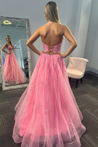 Trägerloses, langes Ballkleid mit Paillettenapplikationen und Korsett in Rosa PSK625