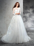 Robe de mariée en tulle longue à manches longues avec col transparent et fleurs faites main en forme de robe de bal
