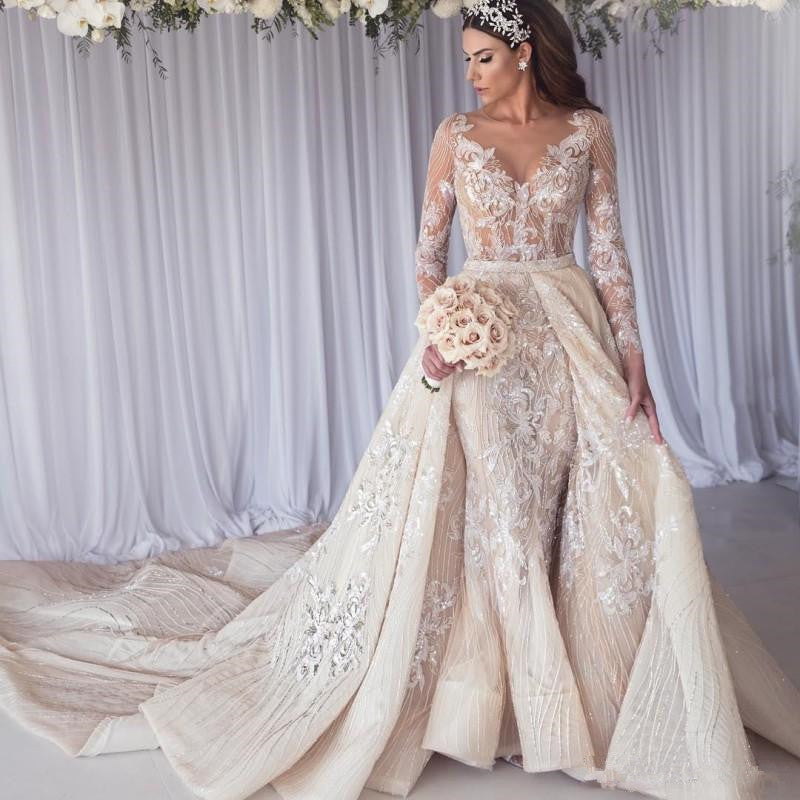 Schönes Brautkleid mit langen Ärmeln, Spitze und Meerjungfrauen-Überrock