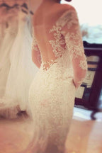 Robe de mariée sirène en dentelle avec manches longues et décolleté bustier charmant
