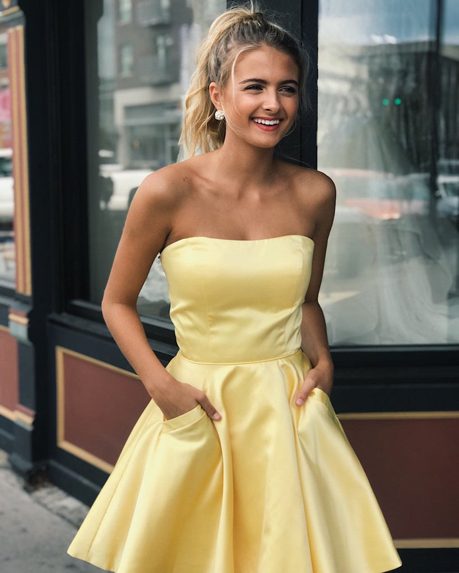 Lindos vestidos de baile curtos em cetim com corte A e bolsos, em tom amarelo