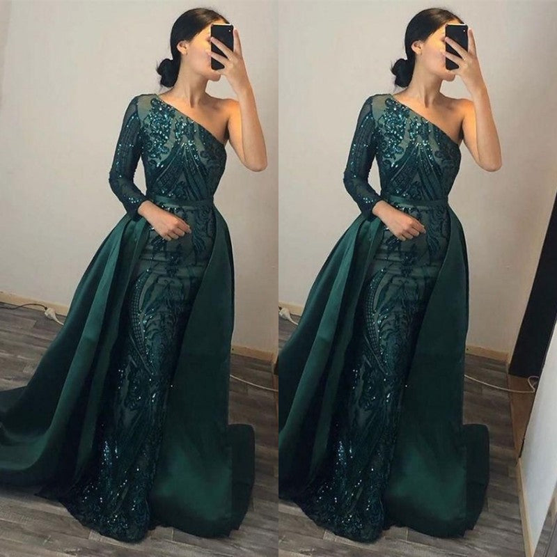 Vestido de festa verde escuro, manga comprida, um ombro, estilo sereia, com sobressaia
