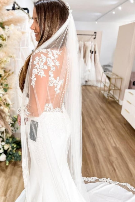 Glamouröses Meerjungfrauen-Brautkleid mit langen Ärmeln, durchsichtigem Rücken und Blumen-Spitze