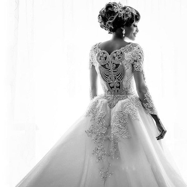 Hochzeitskleid mit Überrock, Meerjungfrau-Schnitt, lange Ärmel, Perlen und Spitzenapplikationen