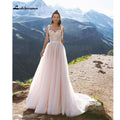 Robe de mariée plage blush rose NumberSea style bohème sans dos