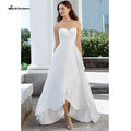 Robe de mariée NumberSea à décolleté cœur, épaules dénudées, courte devant et longue derrière avec plis et boutons dans le dos – abito da sposa corto davanti lakshmigown